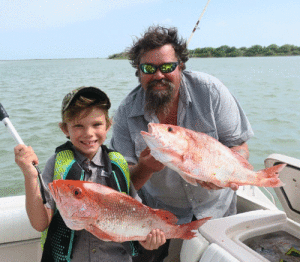 This photo is of Luke Leiker and his son, Kolt, both Port O’Connor residents, was taken during the last days of the 2019 red snapper season.  The seas were somewhat rough while going out to the fishing grounds and also while actually fishing.  Kolt was quite the trooper hanging in there with the bouncing boat and seemed to enjoy all the fishing activity going on around him.  It was great to see father and son making memories together.  The red snapper fishing was great and we hated to see the season come to a close much too early again this year.    				 -Dave Pope