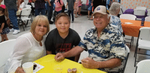 Sally and Calvin Ragusin with grandson Nicholas Ragusin having breakfast at Port O’Connor School on Grandparent’s Day.