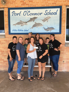 Susan Wallace (POC Learn to Swim Program) donates money to Port O’Connor Elementary Parent, Teacher Organization.