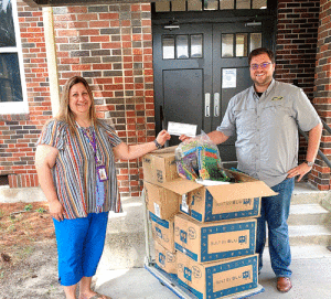 The students and staff at Port O’Connor Elementary are very grateful for the donation of money and school supplies.  Below, Kelly Wehmeyer, Principal, accepts the donation from Craig Staff,HR Manager, Speedy Stop.  POC Dolphins think Speedy Stop is AWESOME!!