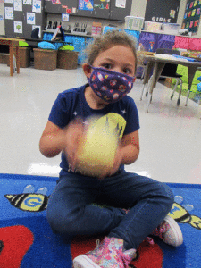 Carter Stringo, from POC Kindergarten, was making butter in the classroom because the class was learning about farm animals and what we get from them.    -Monica Peters