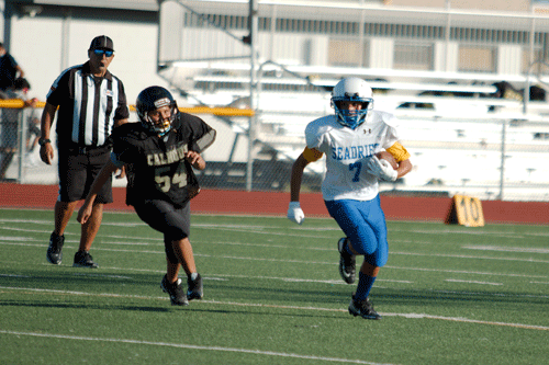 Draven Maldonado (#7) picks up yardage during a 24-0 win over Travis b on the last game of the season, November 16. The Seadrift Pirates ended season 3-4 and 1... having won 3 games straight.      -Coach Anderson  