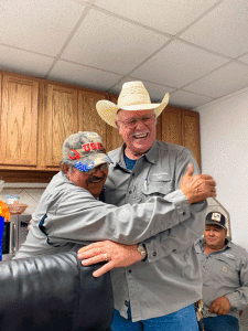 Paul Leal and Virgil Redding share a laugh at their retirement party. 