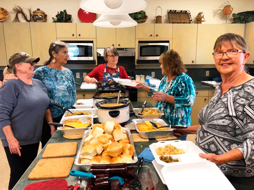 Service Club Members Prepare Christmas Lunches