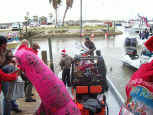 Toys being unloaded from the Toy Run boats (12//5/2020) -Photo by Calvin McIntyre