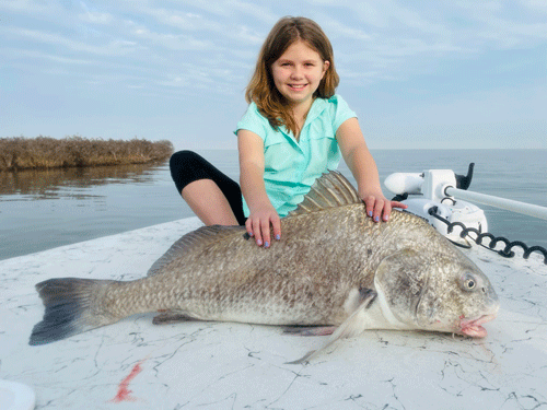 Meryn Rigby causht and released her first big drum fishing with her friend Payton Junek