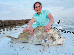 Payton caught and released her first bg drum fishing with her friend Meryn and dad, Allen Junek.