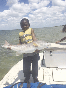 Ranier Brigham’s grandson caught this 29” red all by himself!