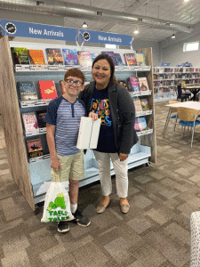 Henry Hamilton, 1st Place Winner of the Port O’connor Library’s Summer Reading Program, with POC Librarian Michelle Marlin.