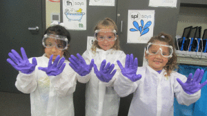 Olivia Marlin, Kynslee Brown, and Lilly Ferretiz show their scientist safety equipment when learning about scientist at Port O’Connor Kindergarten.-Photos courtesy of Monica Peters