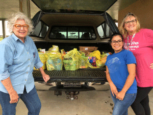 Diane Cooley, Amy Austin, and Kristi Linscomb with donations for POC’s “Hurricane Ida Relief”.