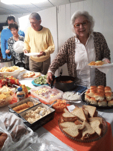 Sharing Fellowship and Food Rick and Judy Patek and Jim and Diane Cooley choose from among the delicious array of refreshments provided by the ladies of St. Joseph Church at the annual Port O’Connor Community Thanksgiving Service, held Sunday, November 14.