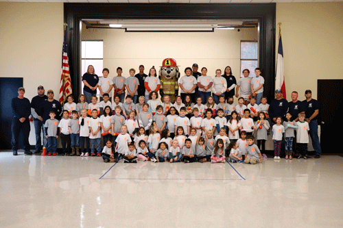 The Port O’Connor Volunteer Fire Department gave a fire safety presentation to the students of POC Elementary. The students ran relay races and went through an obstacle course to become junior Fire Fighters. The students were given T-shirts and personalized reusable water bottles. Thank you to our men and women of the POCVFD and all who participated!			    -Photo by Jenny O’Neill  