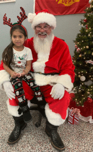 “And I’ve been a very good girl.” Nierah Ysassi talked to Santa Claus at the Port O’Connor Fire Station.
