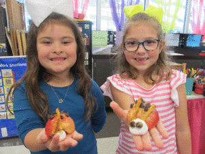 Learning about insects at Port O’Connor School, Hayden Diaz and Kynslee Brown make ladybug snacks.