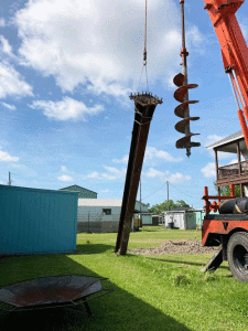 May 14, The base of the 50’ Cross is installed at Fisherman’s Chapel.