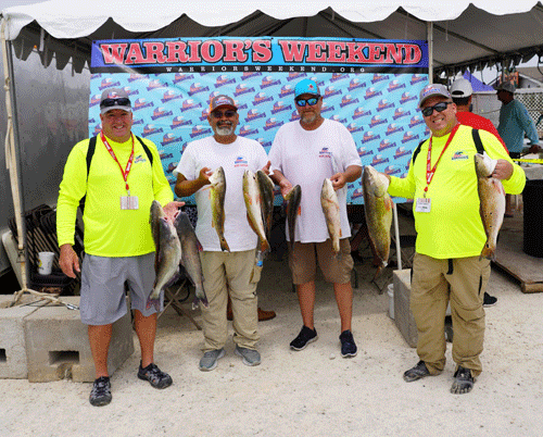 Warrior’s Weekend, 2022 Happy fishermen show off their catches. Thank you, Warriors! -photo by Mike Hessong