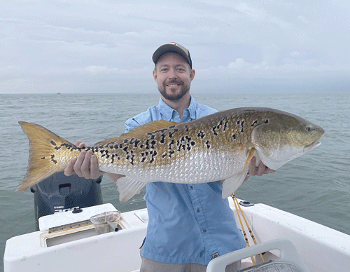 Steve Buckler has been fishing in Port O’Connor with his grandpa, Capt. Steve Barringer, since 1991. He’s caught thousands of redfish, but on the morning of July 1, fishing the flats by the jetties, he landed this beauty- 146 “spot”, 38” bull redfish,  