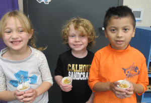 While enjoying the fall weather, POC Kindergarten enjoyed some homemade applesauce. Left to right: Avery Williamson, Rhys McCauley, and Osvin Martinez.