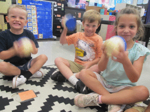 After reading “Click, Clack Moo Cows That Type”, POC Kindergarten drew a problem from the story and their favorite part of the story. Then, they made butter to eat as a snack. Pictured left to right: Reef Chance, Brodie Tubbs, and Vivian Kipp whipping up some butter.