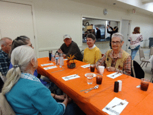 On November 15, area senior citizens were treated to a delicious Thanksgiving dinner presented by the Calhoun County Senior Citizens Association, prepared by a generous group if local folks, and served by members of the Anchor Club. Pictured, far right, Linda Emery won the door prize.