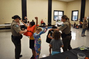 Game Wardens-Elizabeth Guevara and Jessica Pelzel showed POC School children the correct way and explained why the proper size of a life jacket is important.