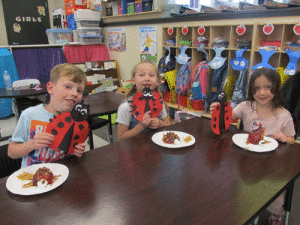 Spring has sprung!  POC Kindergarten has been learning about ladybugs by making a craft with ladybugs and an eatable snack that looks like a ladybug.  Showing off their creations are left to right-Brodie Tubbs, Brooklyn Vossler, and Alessia Smith. -Monica Peters