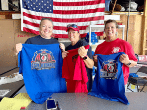 Jana Gregory, Jenny O’Neill, and Sharon Steffer selling POCVFD T-shirts