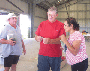 Sept. 2008: John Yearwood and Vidal Resendiz watch as Erny McDonough draws the winning raffle ticket. One of many charitable events in Port O’Connor.