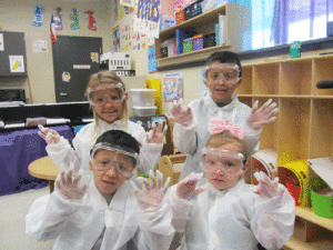 Ms. Peters’ Port O’Connor Kindergarten class is kicking off the school year by learning what scientists wear to keep themselves safe. Dressed up like scientists-left to right seated Alex Gutierrez and McKinley Dufner, standing-Everly Pompa and Osvin Gutierrez