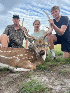Straton Carey, 14, of Inez got lucky and shot this huge deer. He is pictured here with his sister, Loral, and his dad Mike Carey 	Straton’s grandparents are Bonnie and Clay Coffee of Port Lavaca and Theresa and Joe Krenek of Port O’Connor.