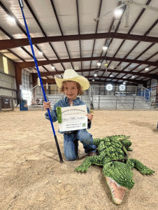  Intercoastal 4H Clover Kid Rhys McCauley exhibits his “alligator” at the Calhoun County Fair.