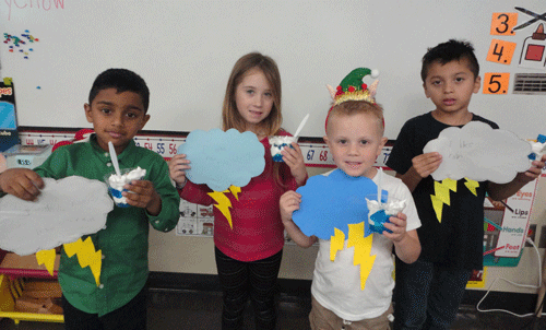 When learning about the weather and clouds, POC Kindergarten wrote if they like rain or not and explained why.  Also, they enjoyed a cloud snack.  Pictured left to right-Shivaay Patel, Skyla Thumann, Hunter Kalina, and Osvin Martinez.           -Monica Peters