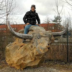 Dieter Erhcard, proprietor of the Art Boat, wishes all his Seadrift area friends a “Happy New Year”. He has just announced the completion of his newest work in his native Germany. “El Toro”. It consists of a 7-ton boulder with stainless steel horns and tail. It has one open eye, which stands for our world politic. He plans to later create a cowboy of stainless steel.