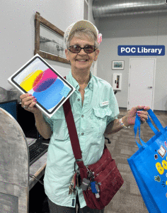   Linda L. Emery won the grand prize, an iPad, for her future reading.