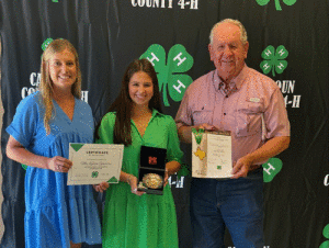 Calhoun 4-H Gold Star Award Winner McKenna Guevara Calhoun 4-H agent Emilee DeForest, left; right, Judge Richard Meyer 