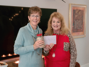 POC’s “Hooked On Books” Book Club held their Annual Christmas Party, and donated their money collection to the “Friends of the POC Library” to be used for their “POC Library Expansion Project”. Here pictured are Book Club member Alane Haardt (right) presenting their donation to Linda Orrick, Vice-President of the Friends of the POC Library. The Ladies wish everyone a “Merry Christmas” and a “Happy Holiday Season”!!