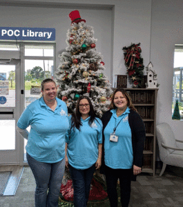 (L-R): Assistant Librarian Margaret Claiborne, Library Director Dina Sanches, and Branch Librarian Michelle Marlin