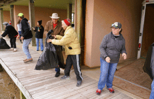 Locals helped unload the toys which were taken to the Community Center where many helpers sorted them.