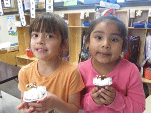 Bobbie Smith and Destiny Banda enjoyed making a groundhog snack during Science time while studying shadows in Ms. Peters' Kindergarten class in Port O'Connor Elementary.